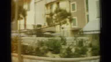 Nice France (1962): View Of A City Street With Parked Cars And Buildings And