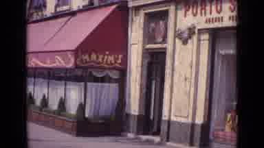 Paris France (1962): A City With Trades Cars And Buses And Flags Raised