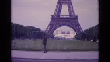 Paris France (1962): Man Looks At The Eiffel Tower And Walks The Opposite Way