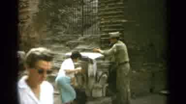 Rome Italy (1962): A Lady And A Man Dressed In Military Uniform Stand Outside A