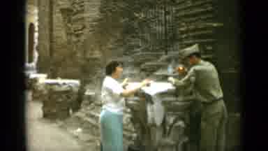Rome Italy (1962): Military Man Lights Smoke And Talks To Lady Then Empty Space