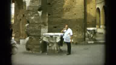 Rome Italy (1962): Man Drinks Beer In Front Of Historic Site In A Moment Of