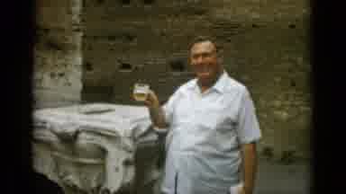 Rome Italy (1962): Man Wearing White Shirt Holds Mug Of Beer On A Clear Sunny Day