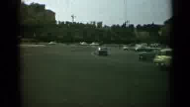 Rome Italy (1962): Area With A Bicyclist Going By With Cars In The Street