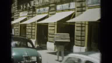 Rome Italy (1962): Man Carries Box On His Back Down Street Then Two Men Walk