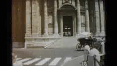 Rome Italy (1962): Many Cars Drive By The Old Looking Buildings In The Bustling
