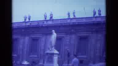 Rome Italy (1962): A Background Of Structured Buildings With People Walking