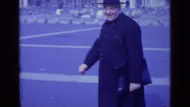 Rome Italy (1962): Man Waves At The Camera As He Heads Towards The Large Ancient