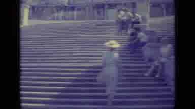 Vatican City (1962): A Fast Shot Of People Sitting Around The Stairs And A Flower