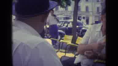 Vatican City (1962): Group Of Friends Chatting Animatedly In Bar In Central City