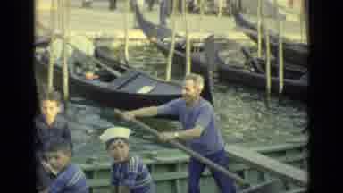 Venice Italy (1962): A Boat With A Few People And A Rower Near Some Busy Seaside