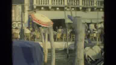 Venice Italy (1962): Gondolas Floating Along A Canal In Venice Italy While People