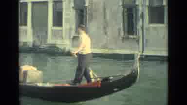 Venice Italy (1962): Canoe Navigates Through Canal In The Famous City Of Venice