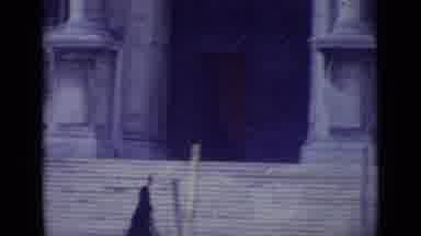 Venice Italy (1962): Priest Walking Down A Street With A Large Cathedral In The