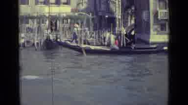 Venice Italy (1962): Gondolier Skillfully Rowing His Gondola In Venice Italy In