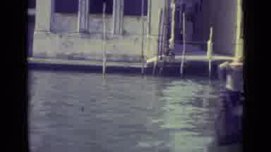Venice Italy (1962): First Boats Then Men Steer One Away From Landing Then View Of