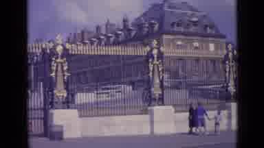 Versailles France-1962: Tourists Walk Past Ornate Gates Of The Palace