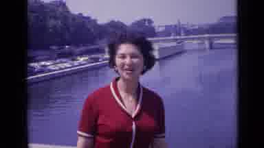 Versailles France (1962): Woman Wearing Red Shirt Talks To Cameraman On A Sunny