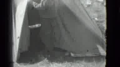 Saint Petersburg Russia (1967): Man Looking Through The Flap Of A Basic Tent At A