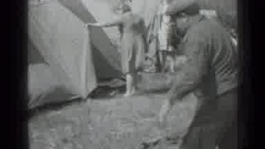Saint Petersburg Russia (1967): Two Young Boys Horsing Around While There Is Work