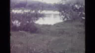 Saint Petersburg Russia (1967): Grass Near Water Switches To Woman In Red Dress