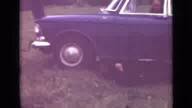 Saint Petersburg Russia (1967): Man Lies Beneath Car Working On Something As Man