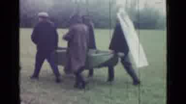 Saint Petersburg Russia (1967): Men In Raincoats Portaging A Boat To A Swamp On A