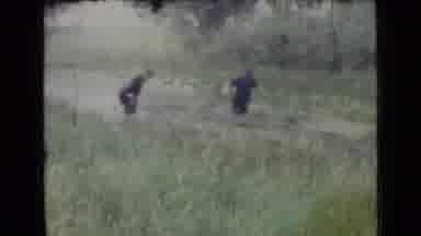 Saint Petersburg Russia (1967): Grainy Video Image Of Two Men Walking Into A Swamp