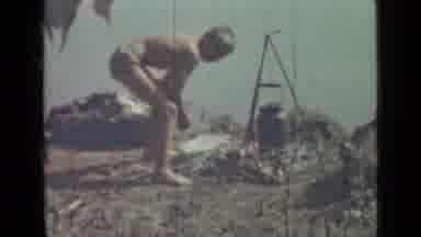 SAINT PETERSBURG RUSSIA-1967: Young Boy Boiling Water Outdoors