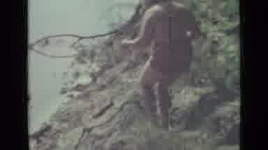 Saint Petersburg Russia (1967): Fat Woman Makes Her Way Down Riverbank With Both