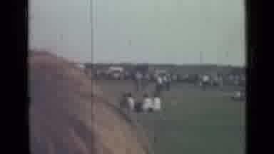 SAINT PETERSBURG RUSSIA-1967: Crowds Gathering Along Riverbank On A Clear Day