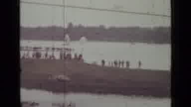 SAINT PETERSBURG RUSSIA-1967: People Watching Parachuting By The River