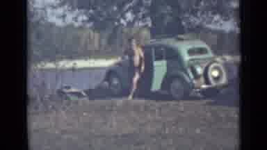 Saint Petersburg Russia (1967): Man In Bathing Suit Exits Car And Passes People