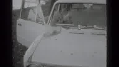 Moscow Russia (1975): Women Grabbing Her Belongings From Her Car Then Closing The