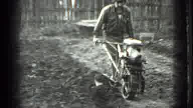 Moscow Russia (1975): Man Opens Ground For Crops With One Wheel Motorized Tiller