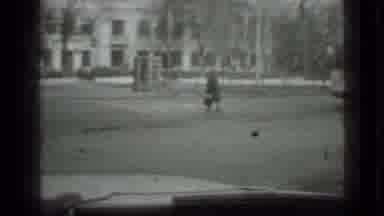 Moscow Russia (1975): Woman Walking Across The Street On A Busy Path With Rumbling