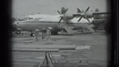 Moscow Russia (1983): People With Umbrellas Wait On Tarmac Then People Walk Toward