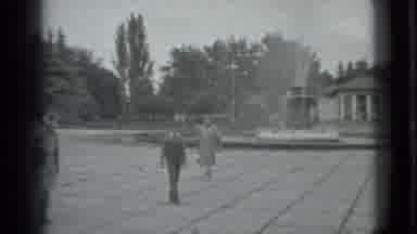 Moscow Russia (1983): People Walking Around A Fountain In A Plaza In Black And