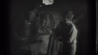 Moscow Russia (1983): Boy And Old Man Hammer On Object Inside Dimly Lit Workshop