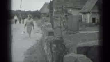 MOSCOW RUSSIA-1983: A Woman Walking Down A Dirt Path In A Rural Village