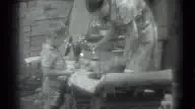 Moscow Russia (1983): Woman At Low Table Offers Something To Small Child Who Looks