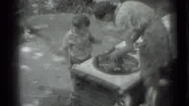 Moscow Russia (1983): Woman Showing Young Child A Magic Trick On Stone Bench