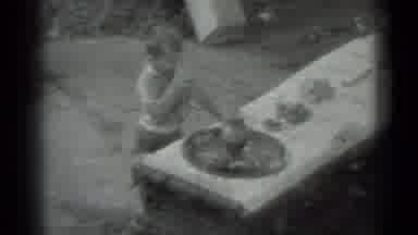 Moscow Russia (1983): Black And White Film Of Adult And Child At An Outdoor Picnic