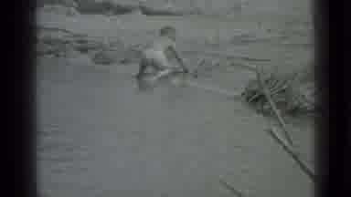 Moscow Russia (1983): Little Boy Playing On The Bank Of A Water