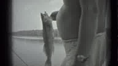 Moscow Russia (1983): Man Who Went Fishing Shows Off His Catch While Relaxing
