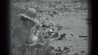 MOSCOW RUSSIA-1983: Mature Lady By The River Wearing A Straw Hat Black And White