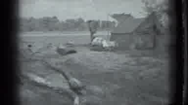Moscow Russia (1983): A Man Stands Next To A Tent On The Banks Of A River While A