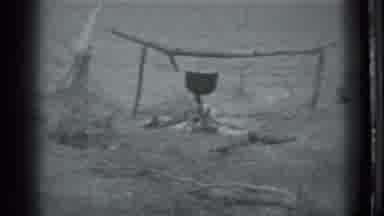 Moscow Russia (1983): Old Footage Of A Campfire With A Pot Over It And Then A