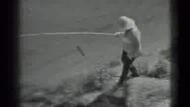 Moscow Russia (1983): A Woman Holding A Fishing Pole Walks Down A Steep Incline To