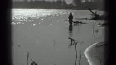 Moscow Russia (1983): A Man Is Fishing By The Lake With The Boat